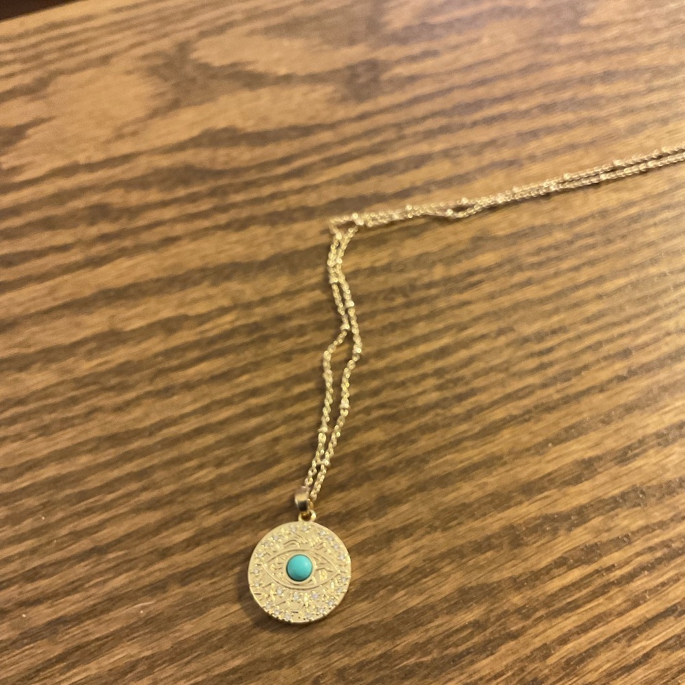 Gold evil eye charm necklace